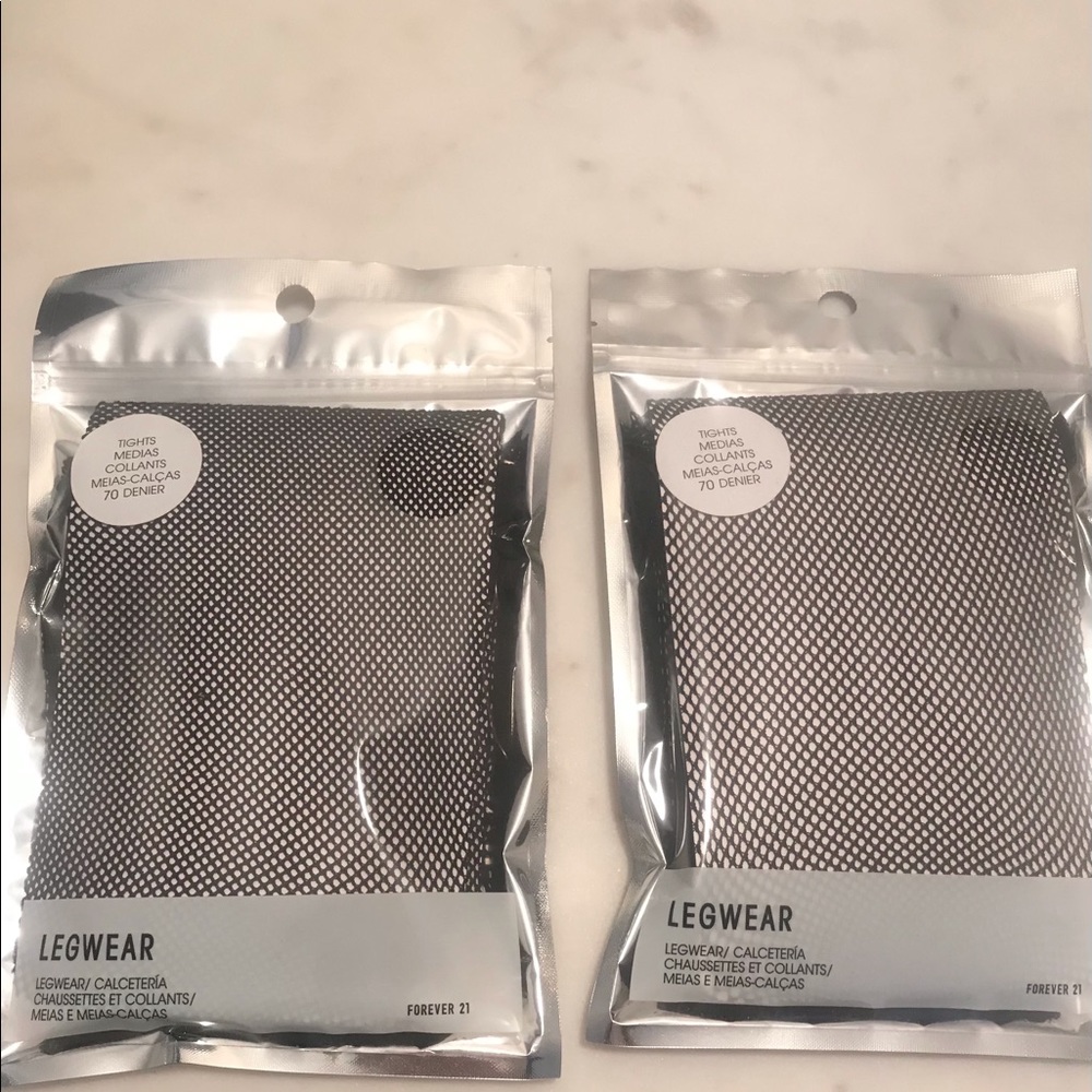 Black fishnet tights never opened. 2 pairs